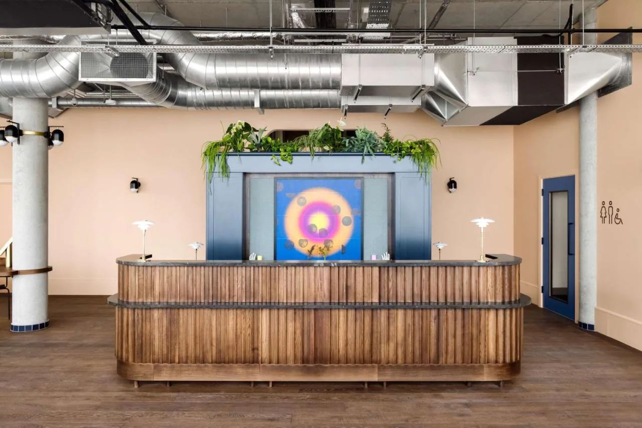 a stage in a room with a painting on the wall at Hyatt Centric Cambridge in Cambridge